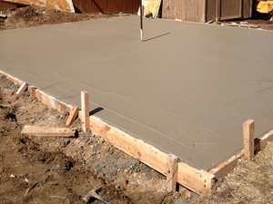 Monolithic concrete foundation with electrical conduit.