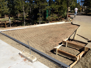New concrete apron tieing in to the existing driveway with integrated steps and drainage.