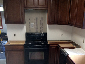 All cabinets installed, walls are painted and backsplash is prepped.