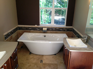 Custom soaking tub and tile tub surround.